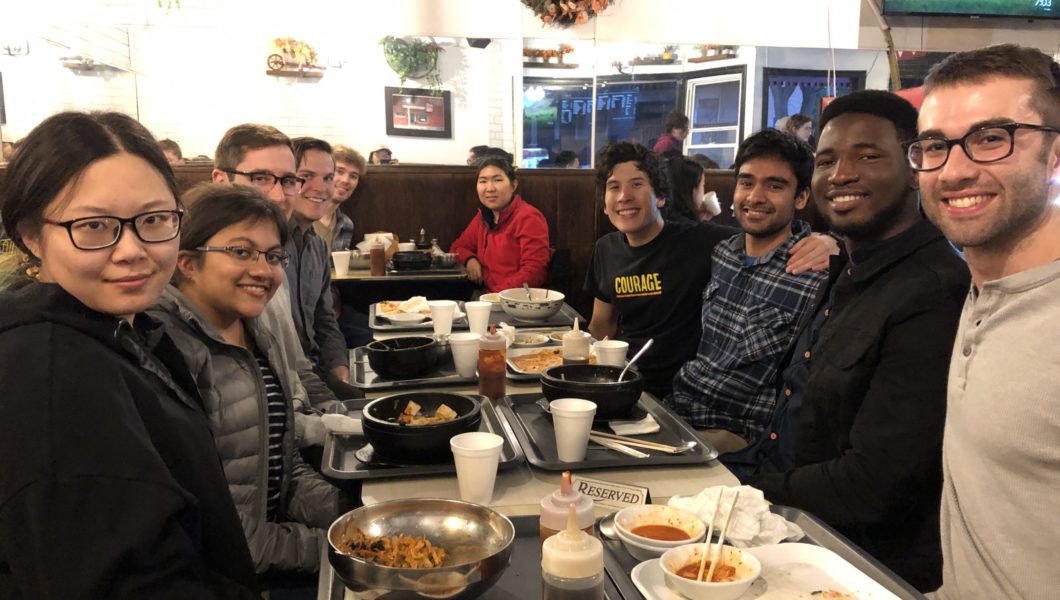 Group photo of the team at a restaurant